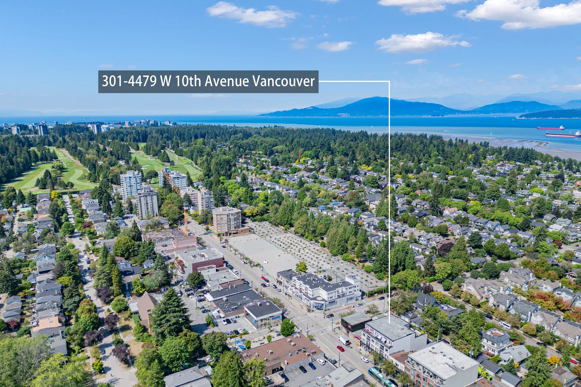 Aerial view over West Point Grey to English Bay and the North Shore mountains, the building marked