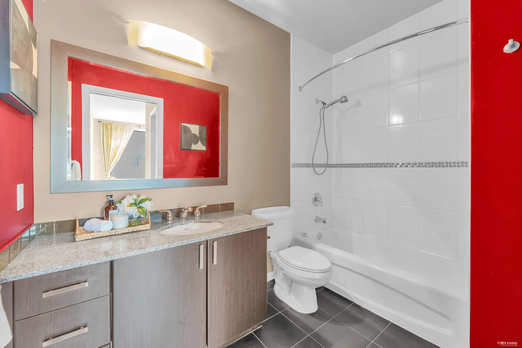 The four-piece ensuite with a bath and shower and a granite vanity